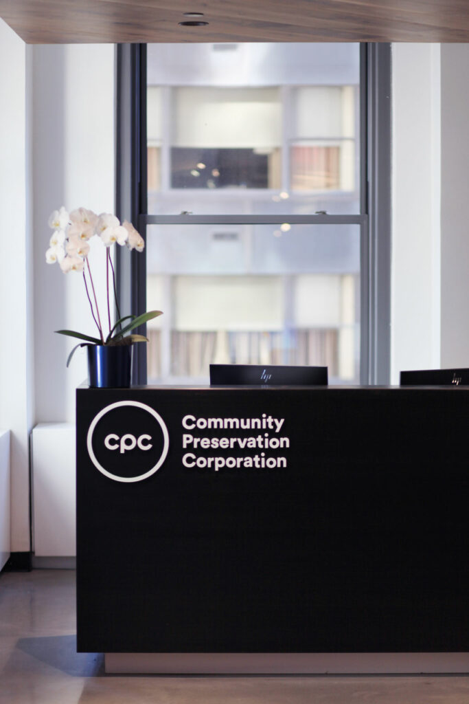 Community Preservation Corporation logo on desk