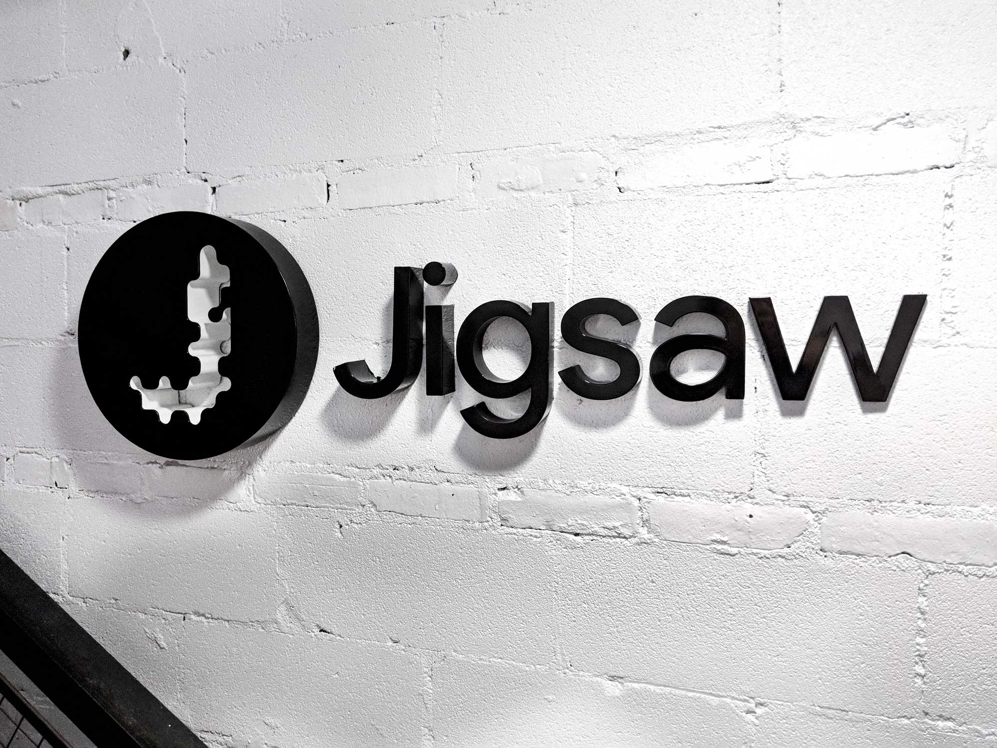 Jigsaw logo sign