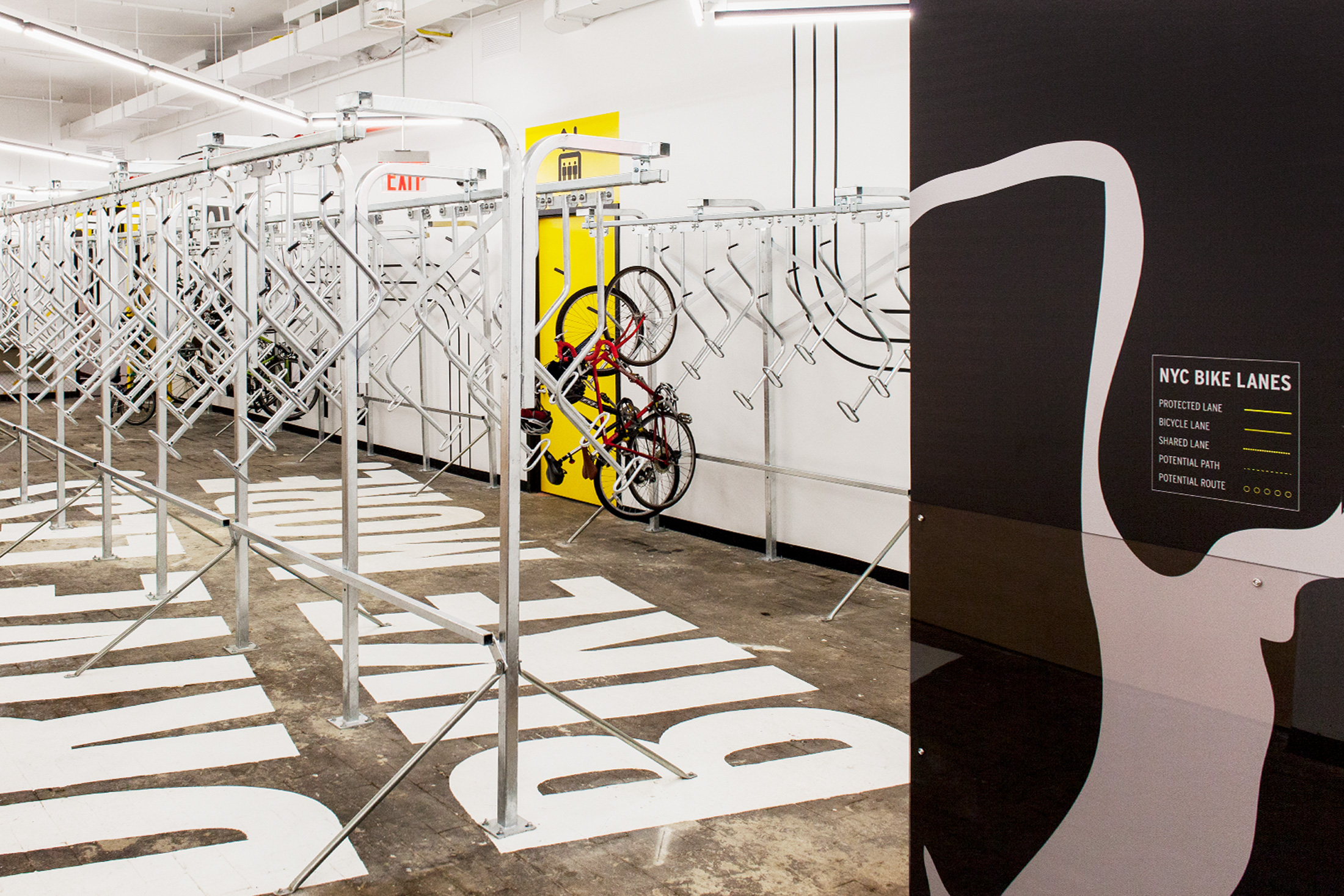 Environmental graphics in bike garage for New York on Two Wheels.