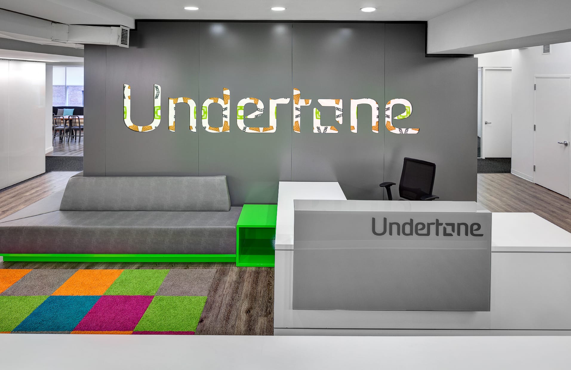 Large illuminated and typographic wall treatment for Undertone Headquarters workspace.
