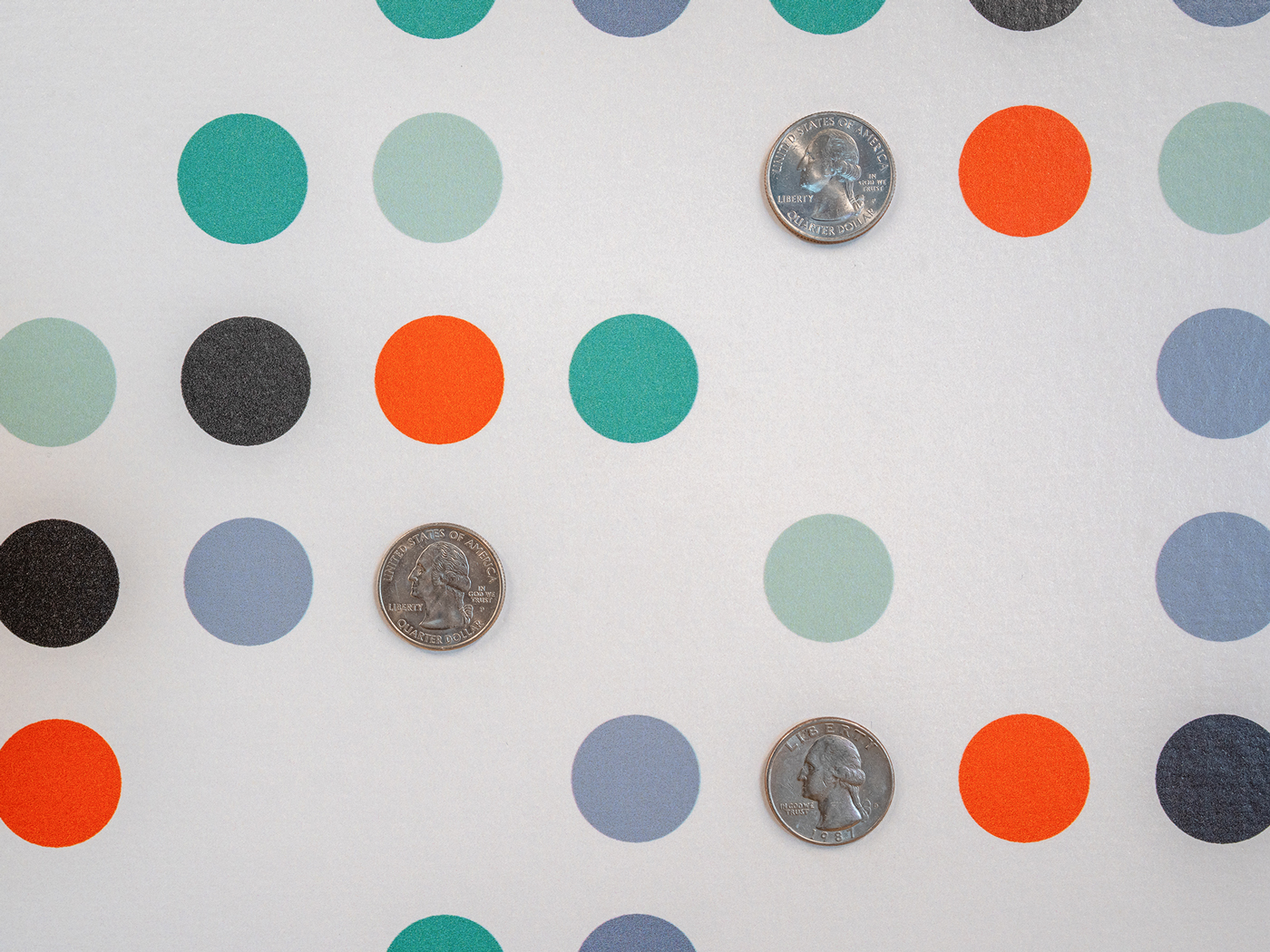 Detail photo of wall graphic with colorful circles and dimes
